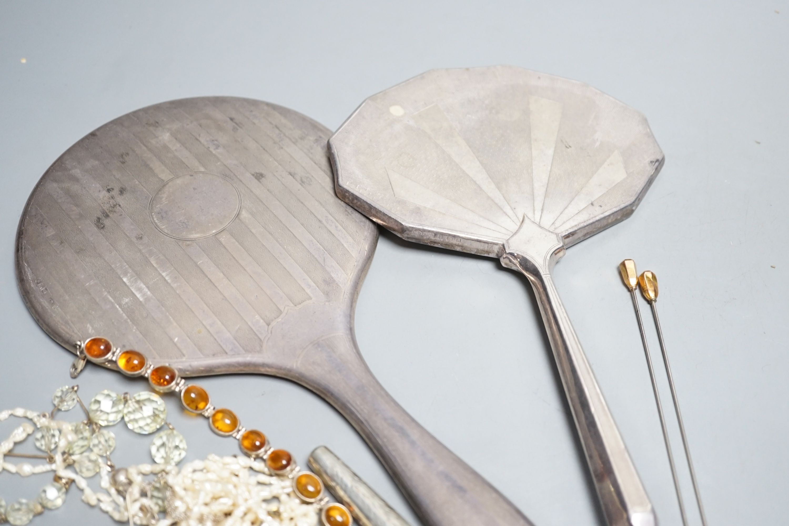 Two silver mounted hand mirrors and a small group of minor jewellery and a silver cigarette holder case.